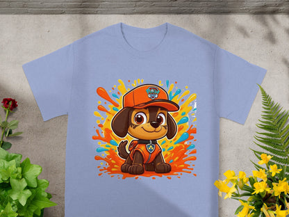 Paw Patrol Marshall character on a light blue t-shirt with colorful paint splatters.