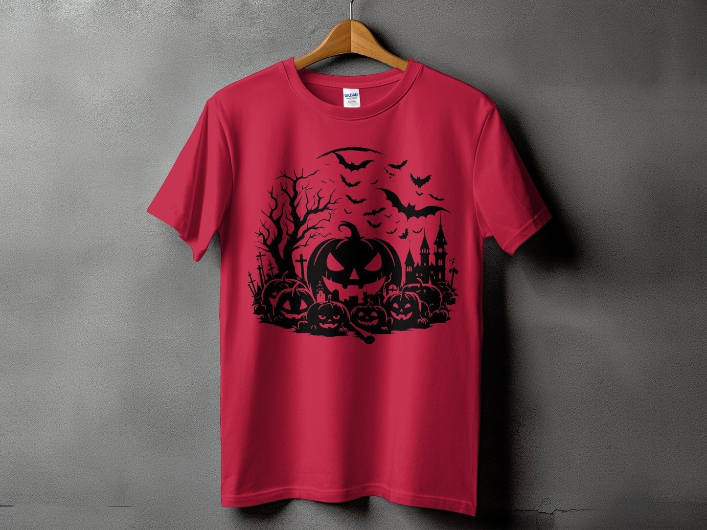 Red t-shirt with a black Halloween graphic of pumpkins, bats, and a haunted castle.