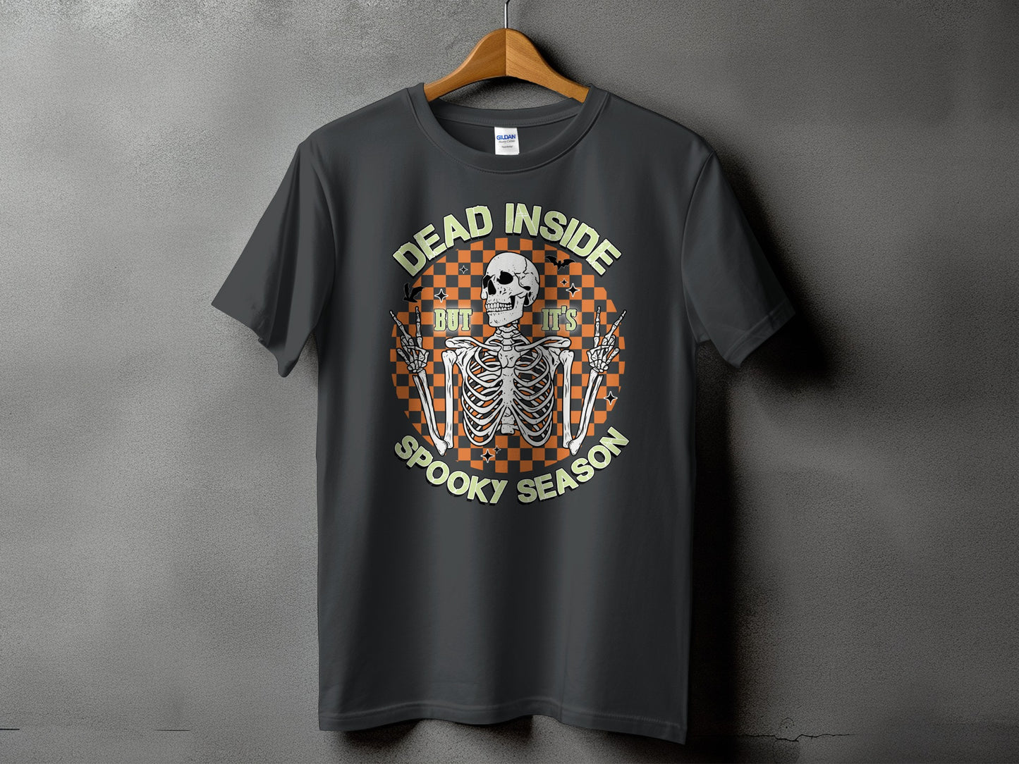 Dark t-shirt with skeleton graphic and text "DEAD INSIDE BUT IT'S SPOOKY SEASON"