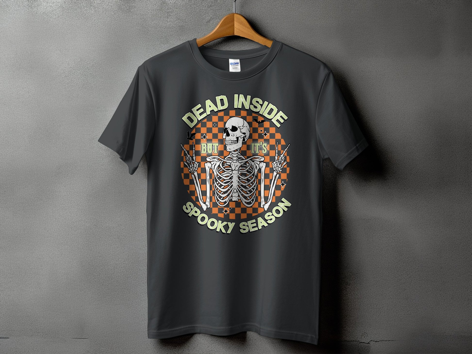 Dark t-shirt with skeleton graphic and text "DEAD INSIDE BUT IT'S SPOOKY SEASON"
