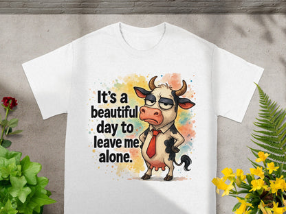 White t-shirt with a grumpy cartoon cow wearing a tie and the text "It's a beautiful day to leave me alone."