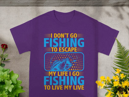 Purple t-shirt with "I don't go fishing to escape, my life I go fishing to live my live" text and fish graphic.