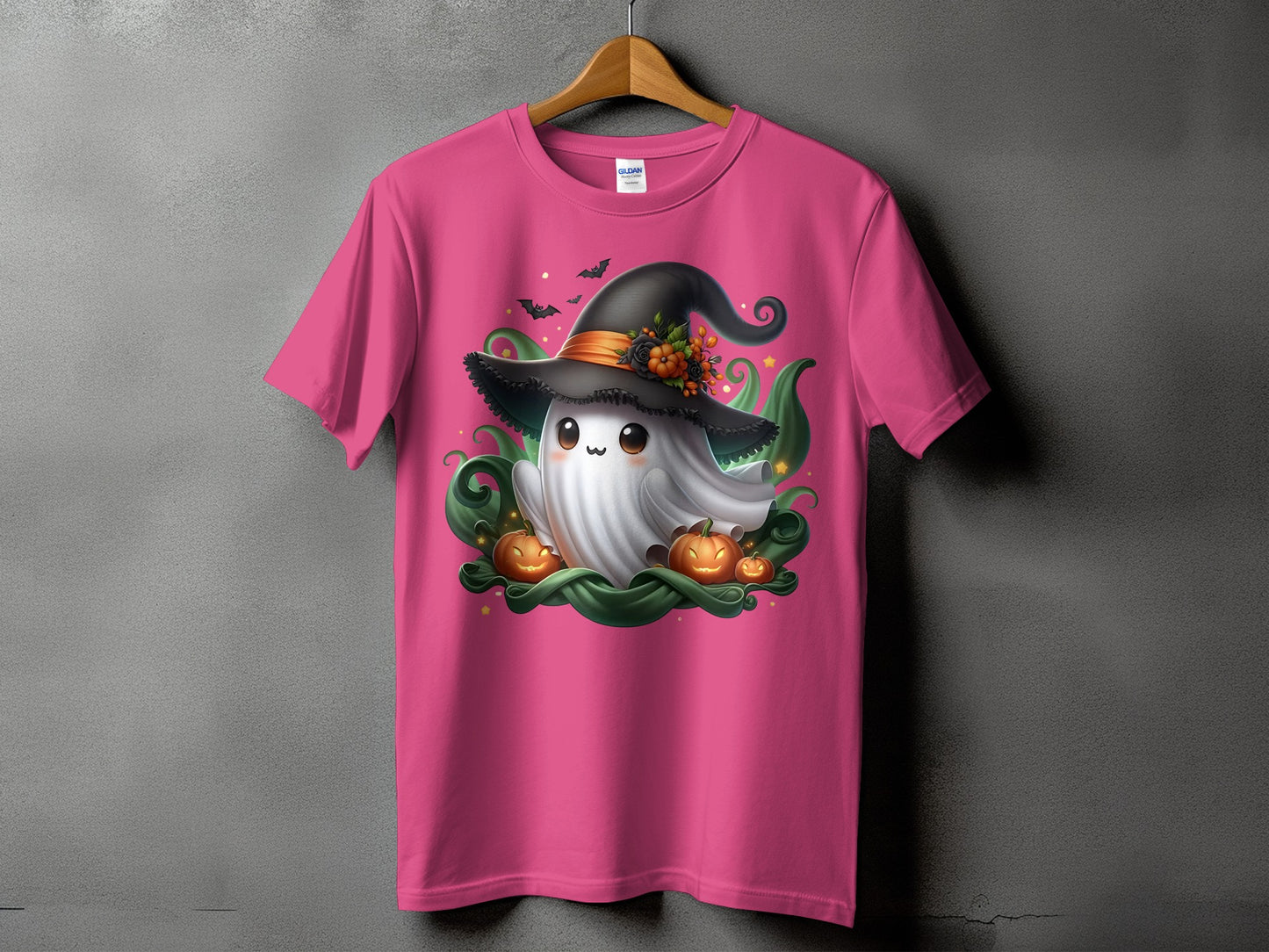 Pink t-shirt with cute ghost, witch hat, pumpkins, bats, and stars design.