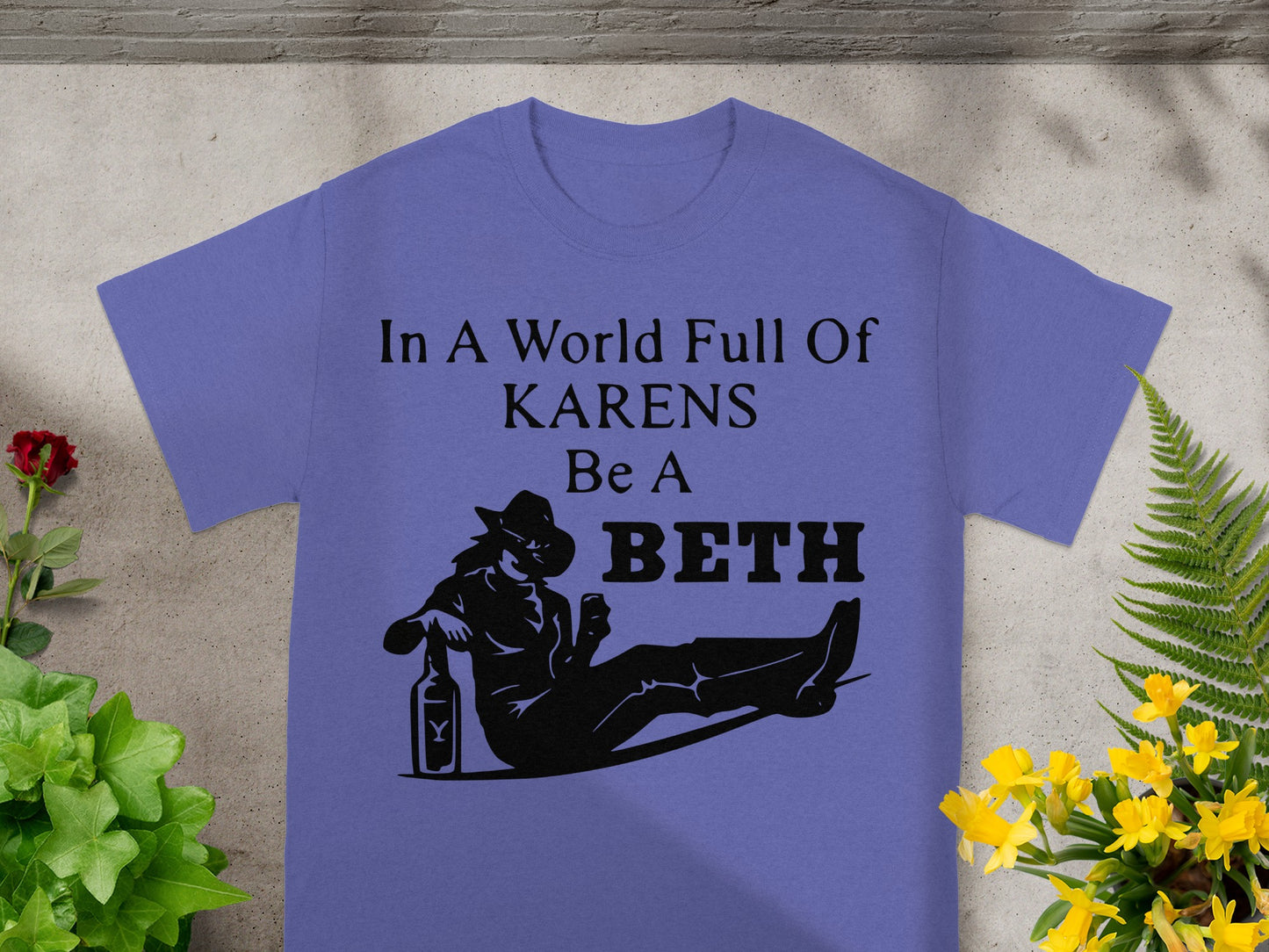 Purple t-shirt with black graphic saying "In A World Full Of KARENS Be A BETH".