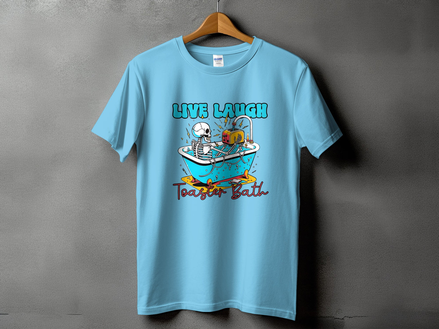 Light blue t-shirt with "LIVE LAUGH Toaster Bath" text and skeleton graphic.