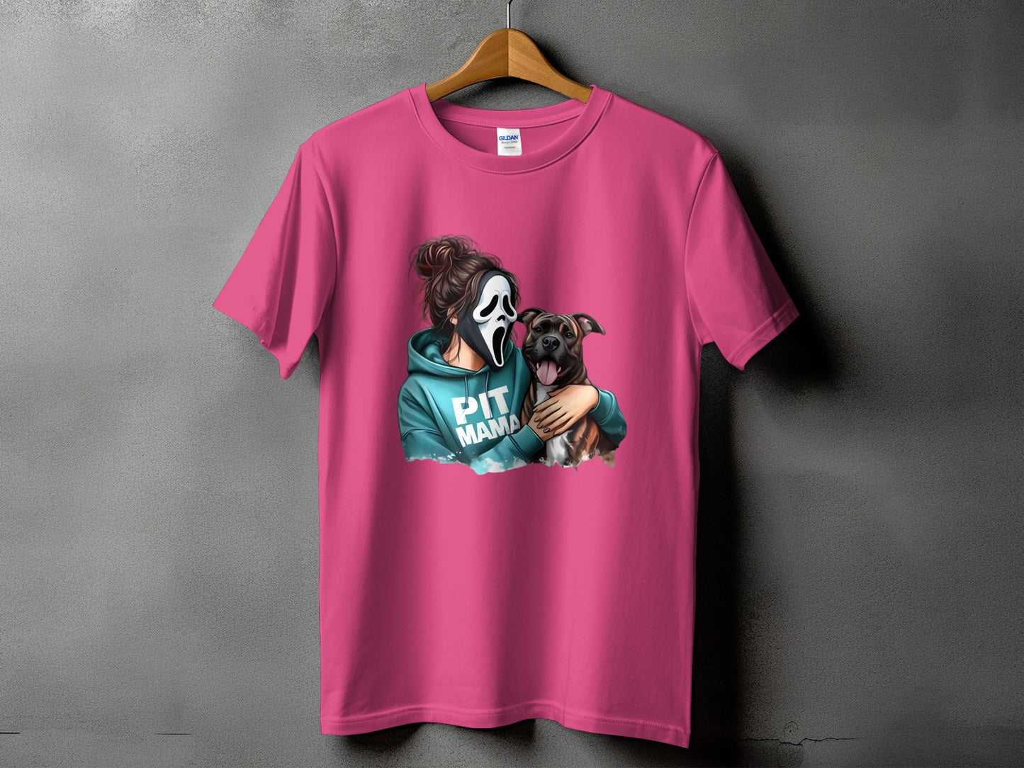 Pink t-shirt with graphic of a person in a Scream mask holding a pit bull, text reads "PIT MAMA."