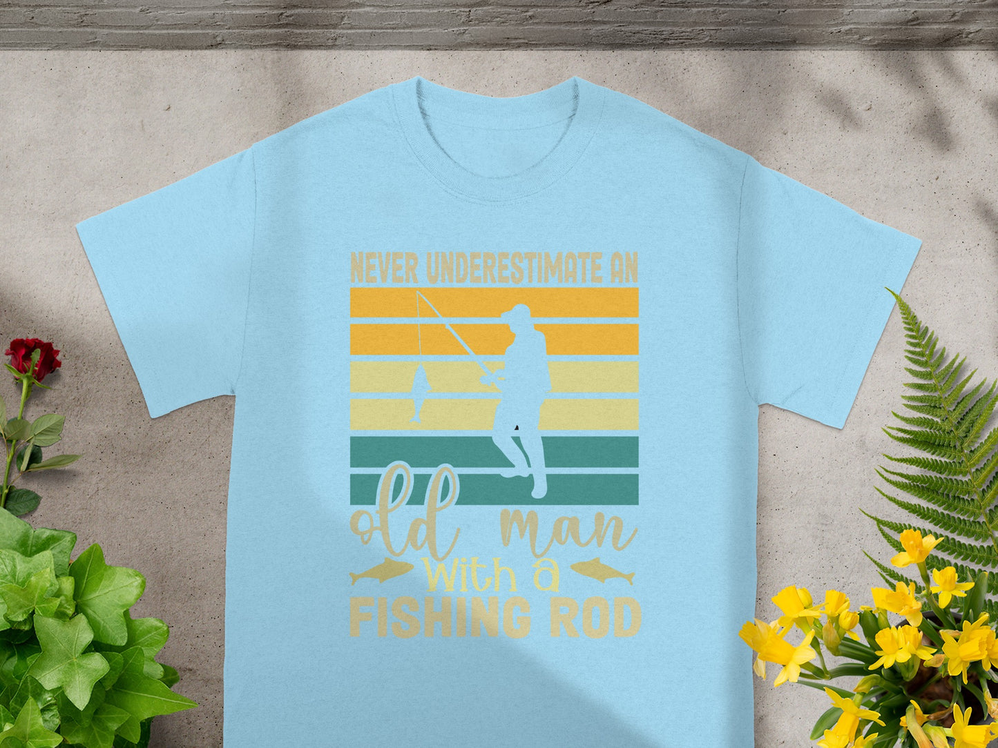 Light blue t-shirt with text and graphic of a man fishing.