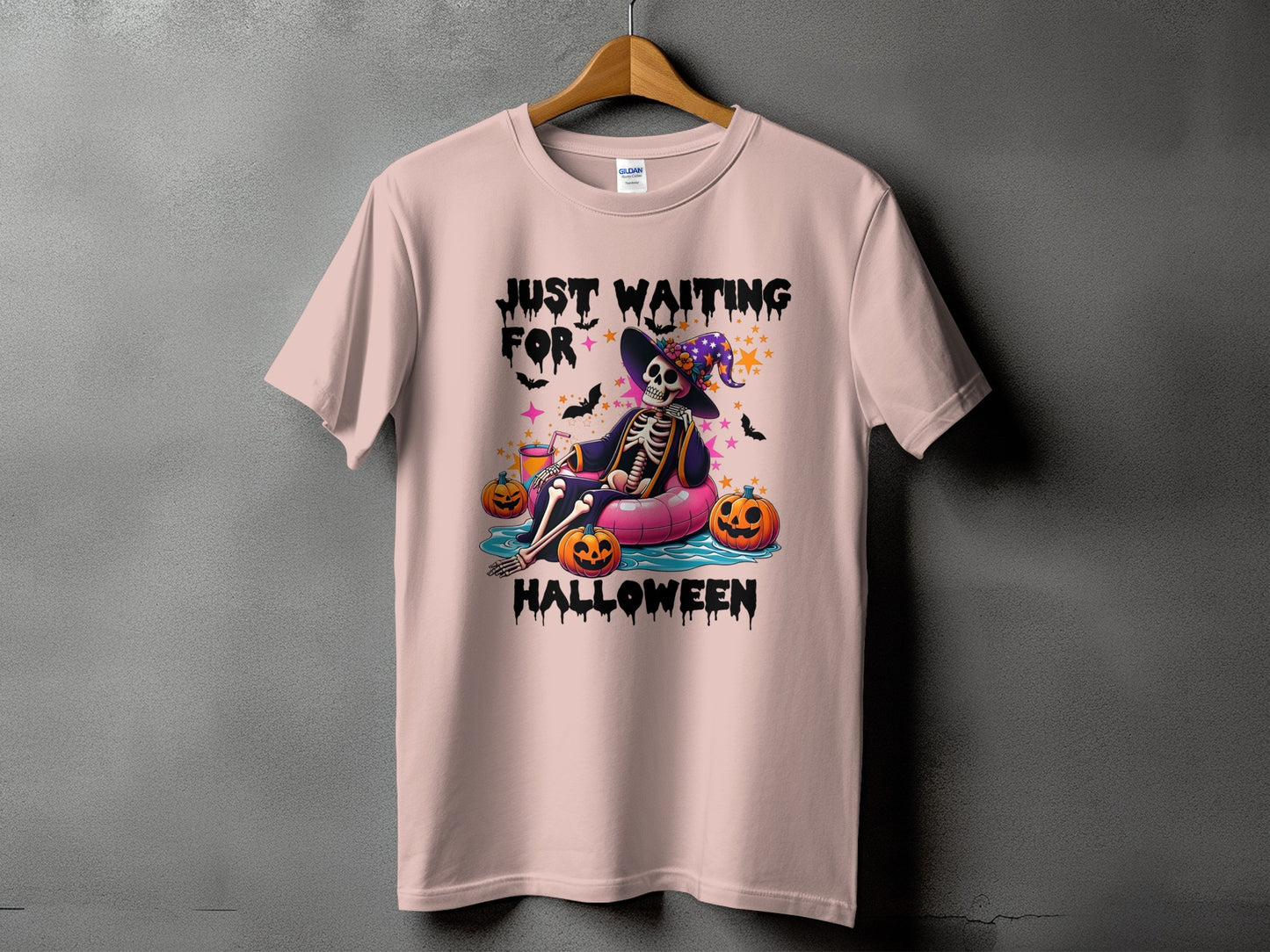 Pink t-shirt with "Just Waiting For Halloween" text and a skeleton graphic.