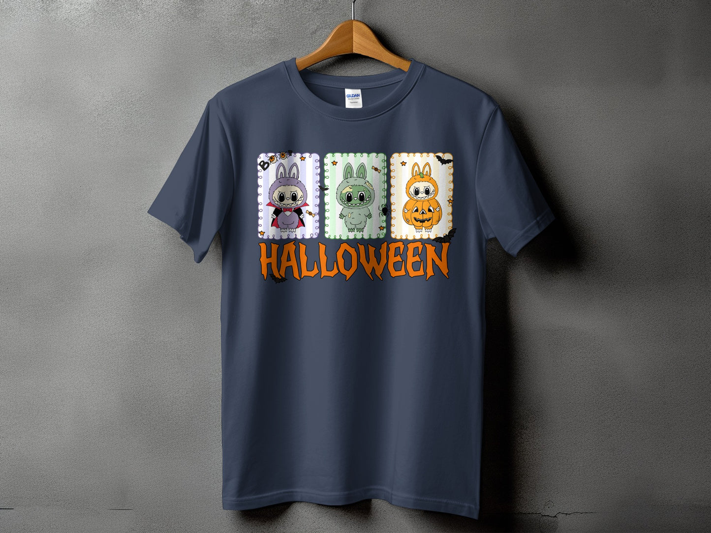 Dark gray t-shirt with three Halloween-themed cartoon bunnies and "HALLOWEEN" text.