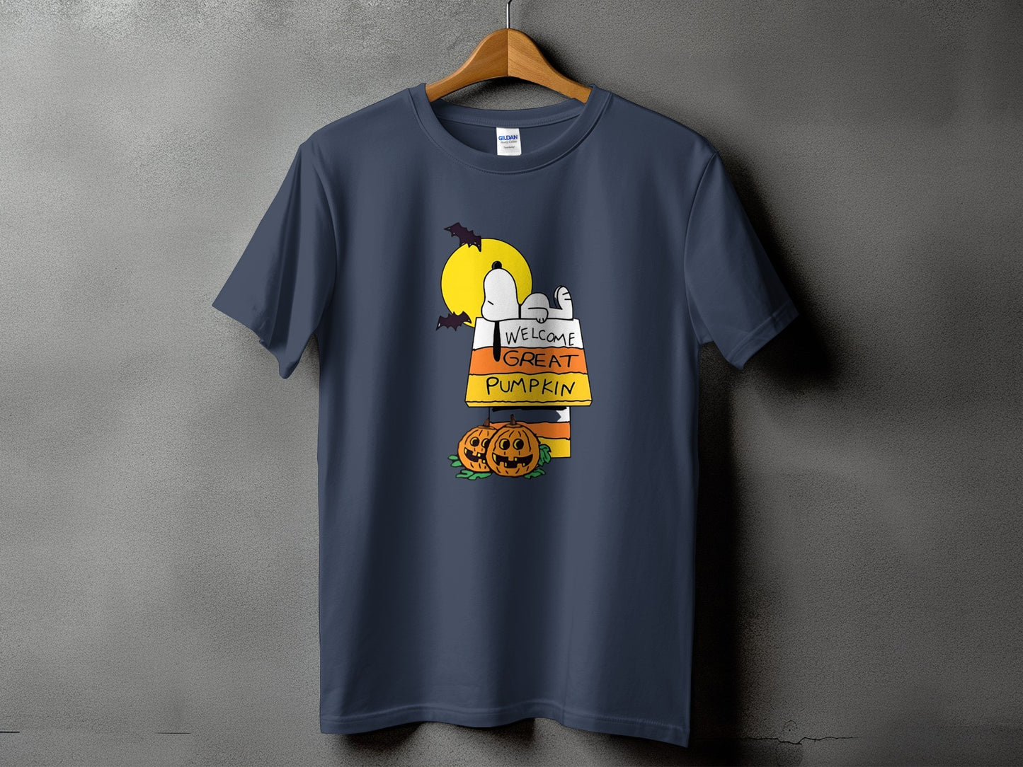 Navy t-shirt with Snoopy and text "WELCOME GREAT PUMPKIN" on candy corn.