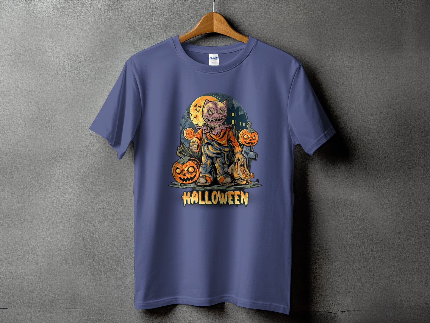 T-shirt with a cartoon Halloween scene featuring a scarecrow, pumpkins, and text.