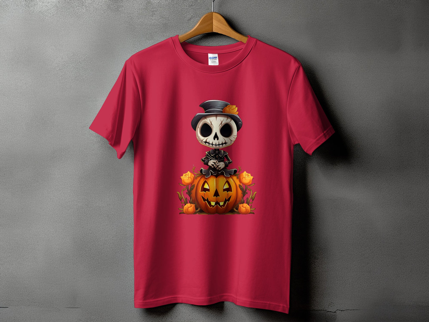 Red t-shirt with skeleton character sitting on a pumpkin surrounded by roses.