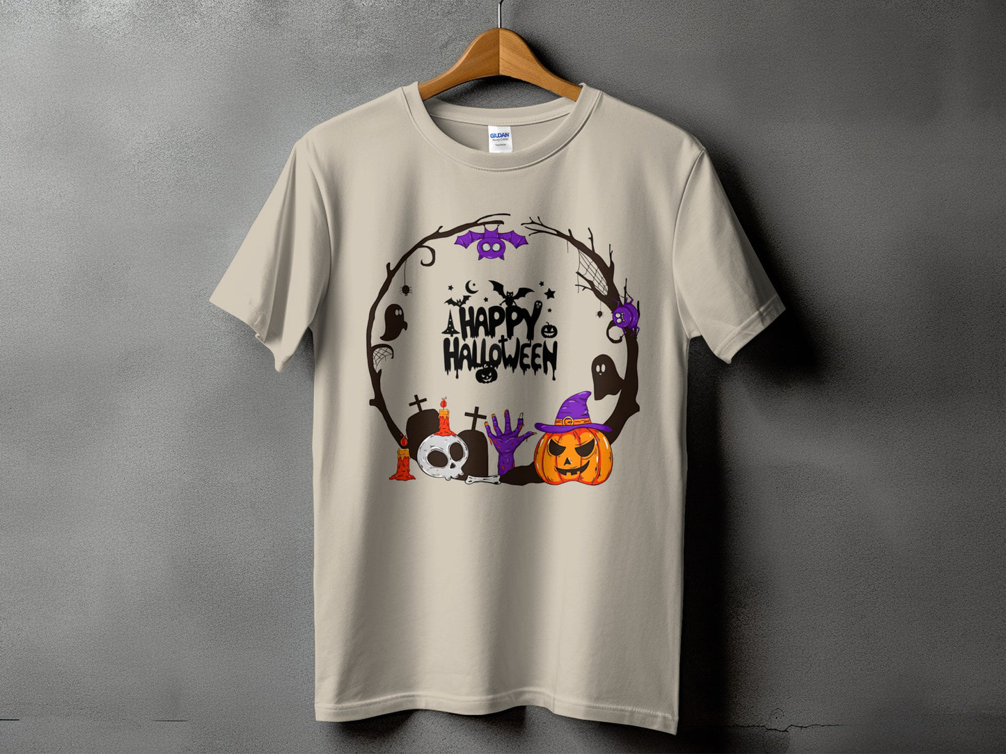 Tan t-shirt with a circular Halloween graphic featuring a skull, pumpkin, and text.