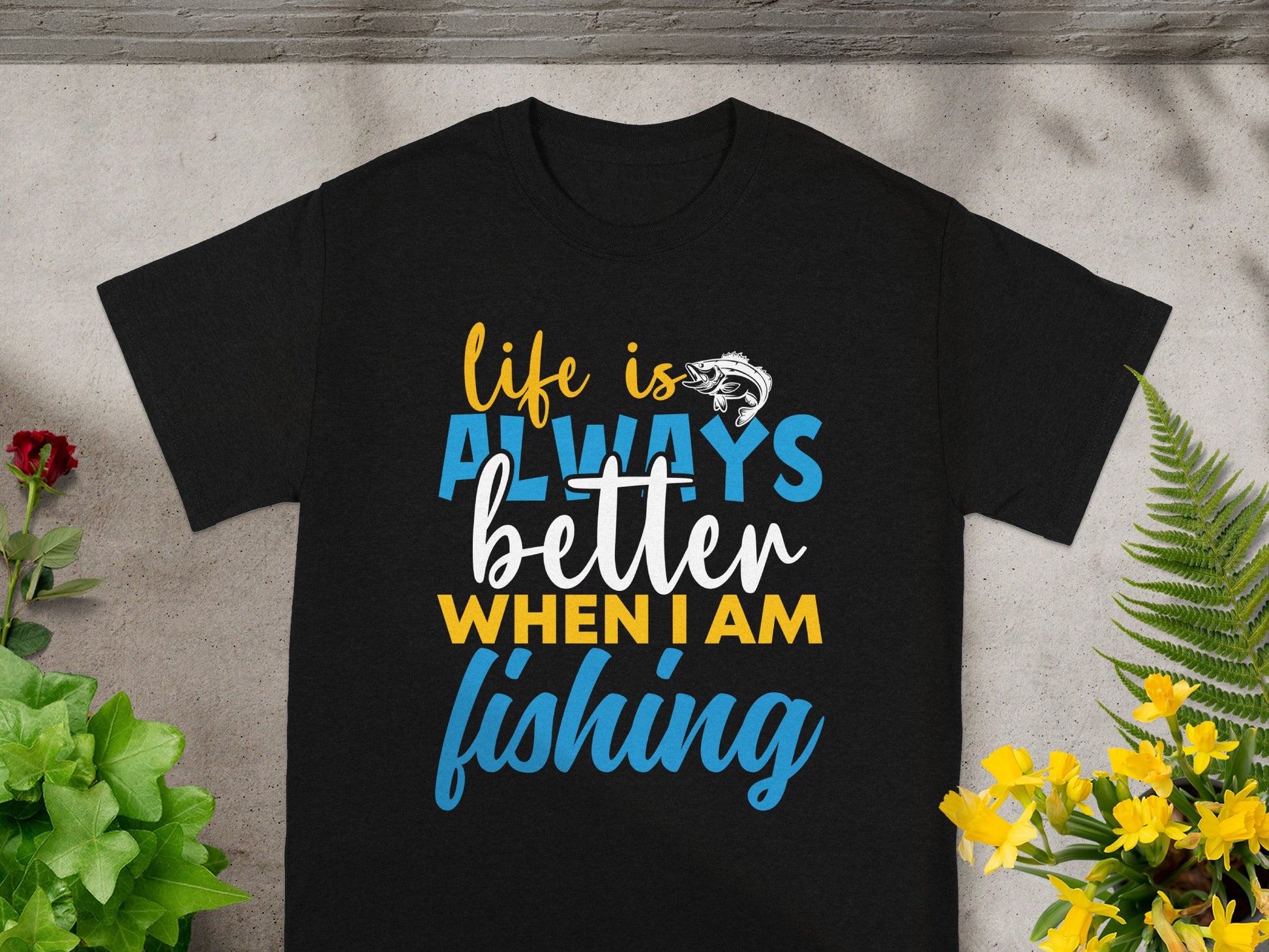 Black t-shirt with text "life is ALWAYS better WHEN I AM fishing" and a fish graphic.