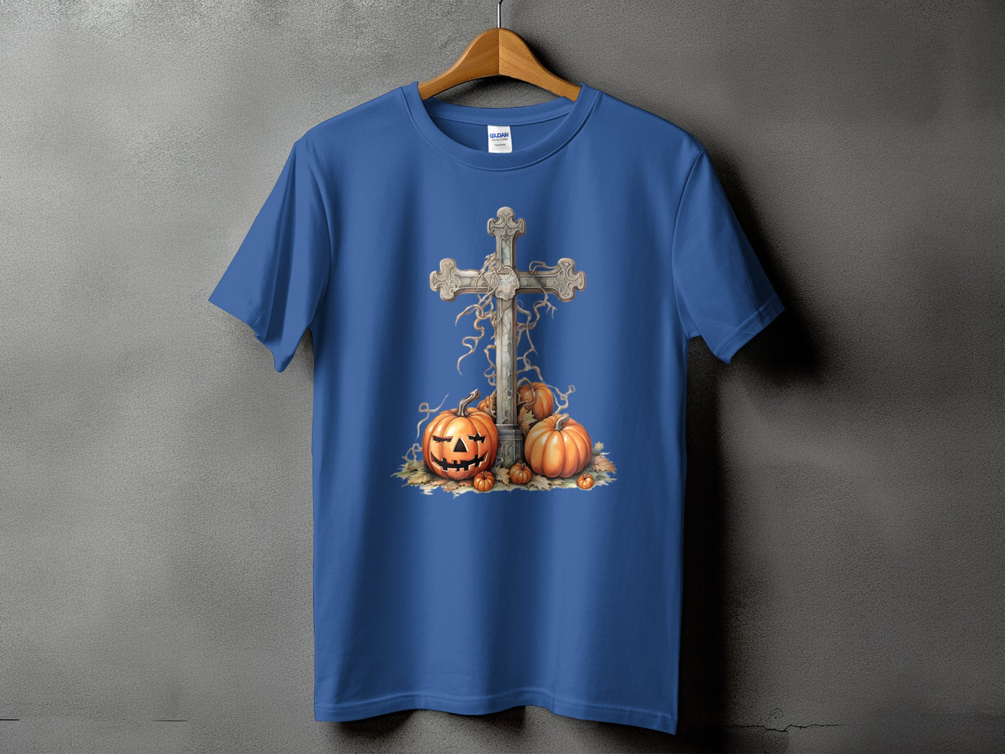 Blue t-shirt with a carved pumpkin and stone cross Halloween graphic.