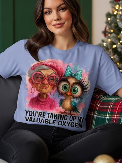 Woman wearing blue t-shirt with cartoon owl and grandma, text "YOU'RE TAKING UP MY VALUABLE OXYGEN".
