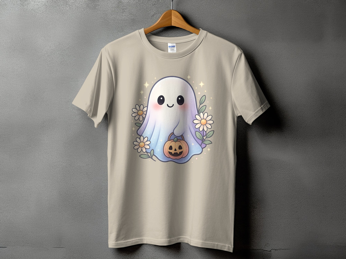 Light beige t-shirt with a cute ghost, pumpkin, and flowers graphic.