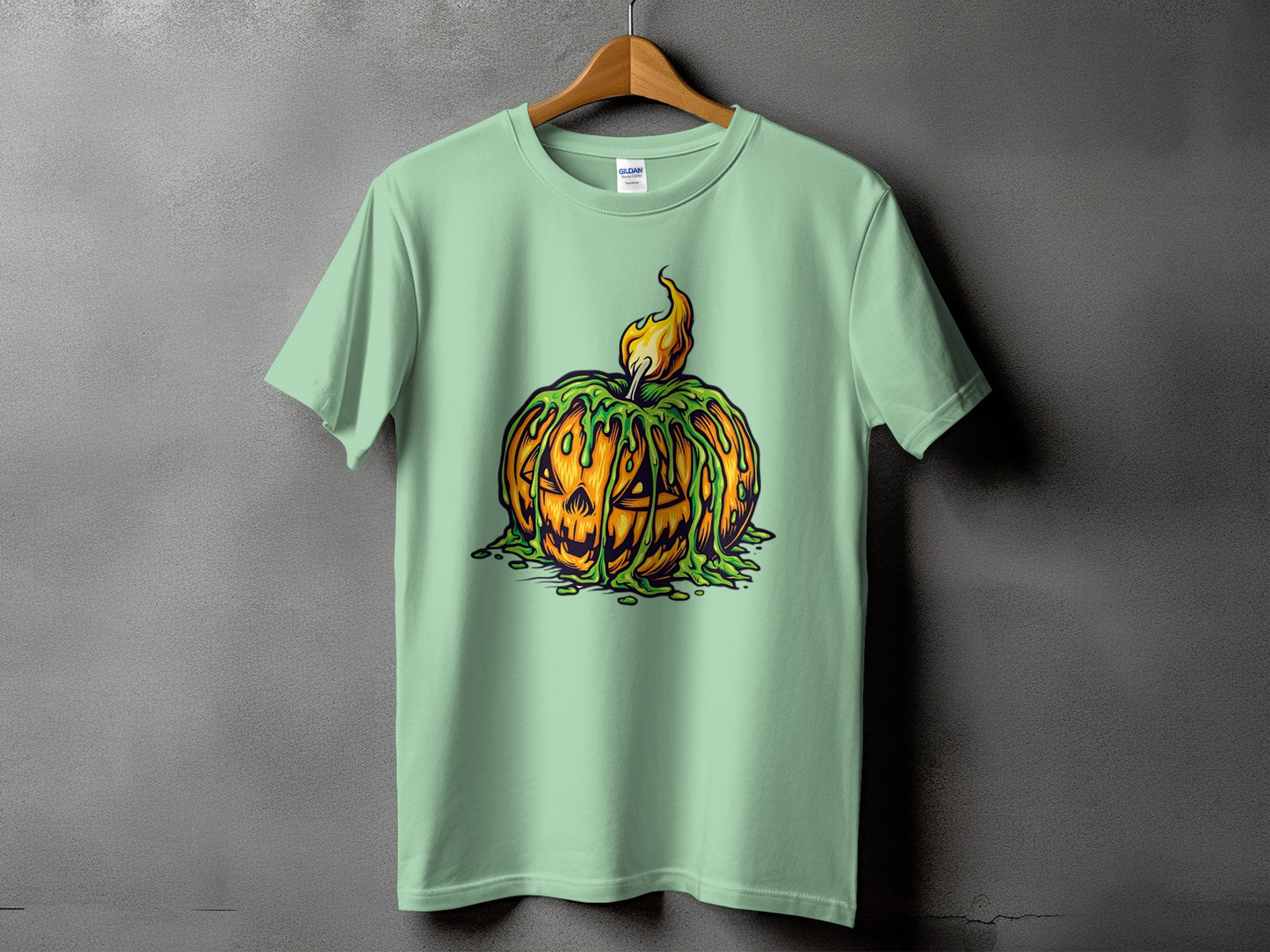 Light mint t-shirt with a melting Jack-o'-lantern and flame graphic.