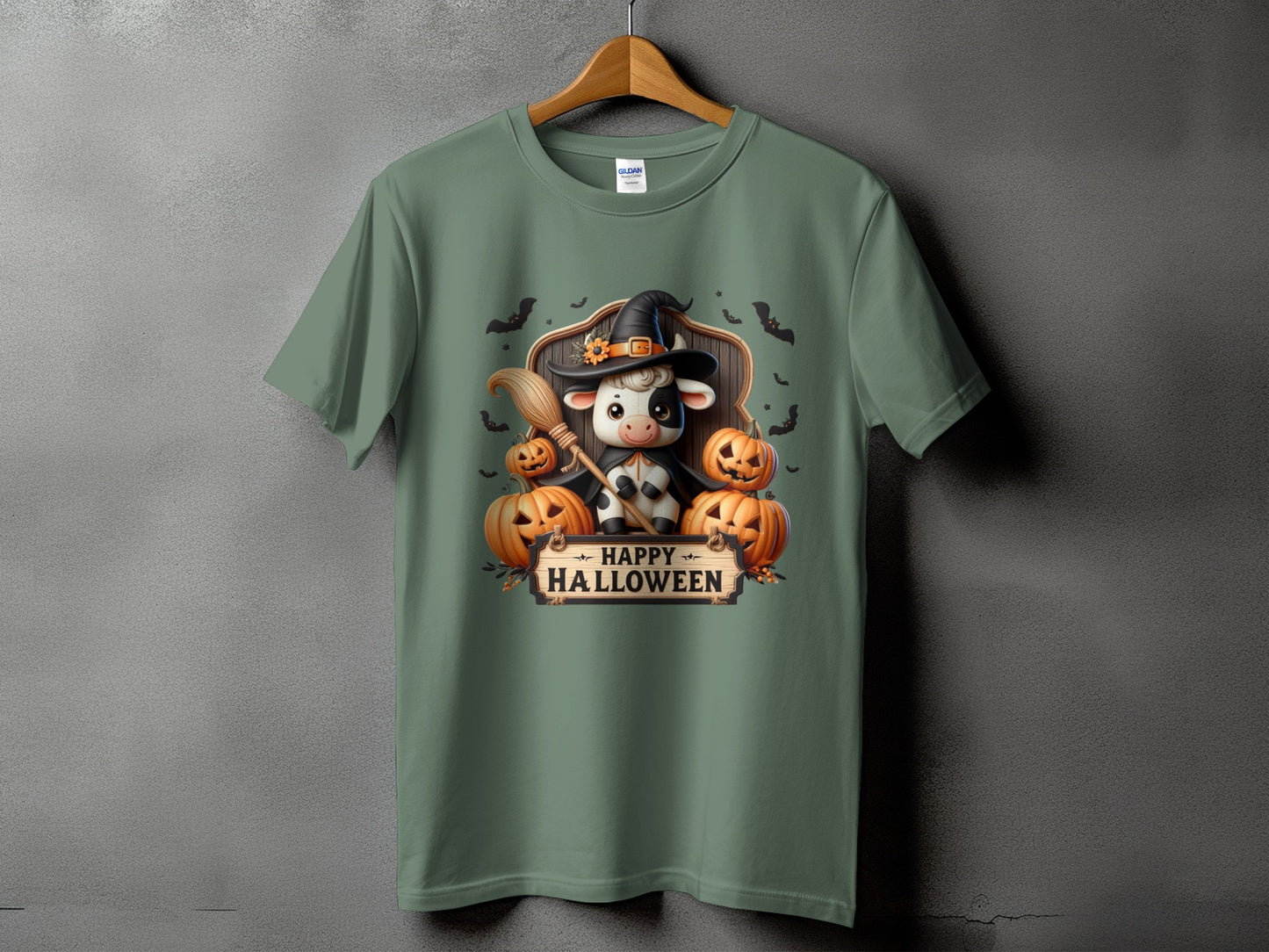 Cow in witch hat with pumpkins and broom, text "Happy Halloween"