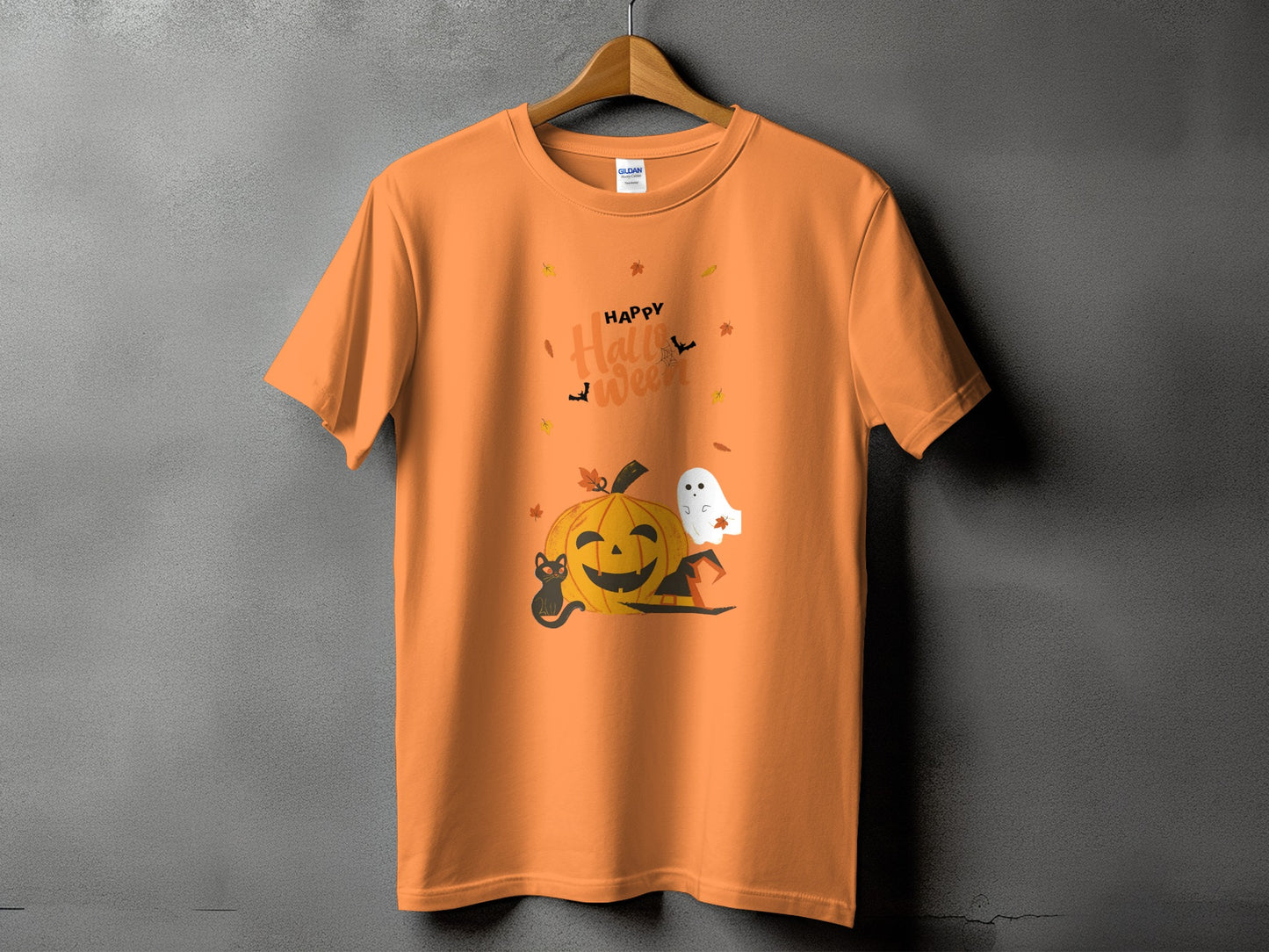 Orange t-shirt with "Happy Halloween" text, pumpkin, ghost, black cat, and witch hat design.