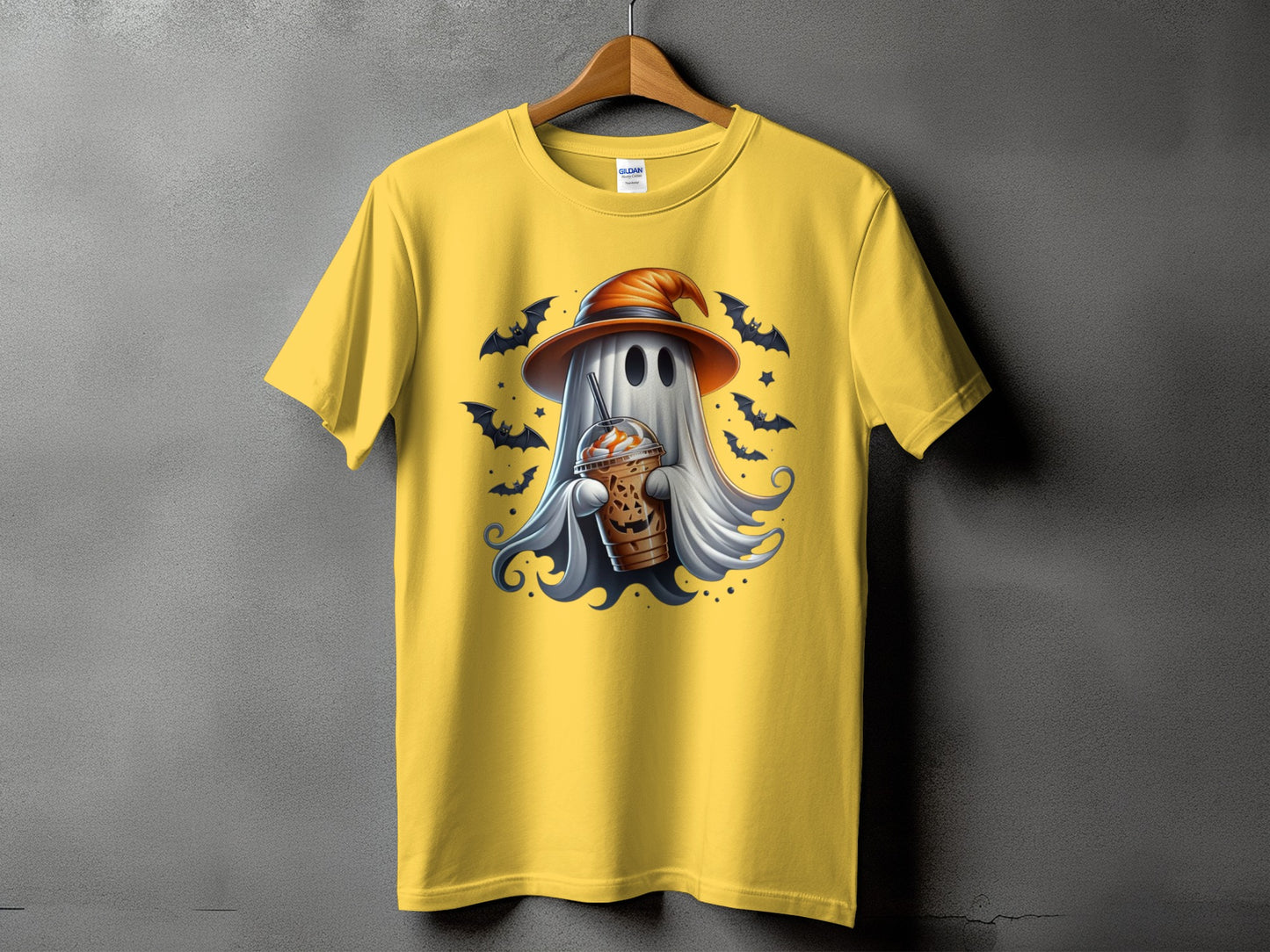 Yellow t-shirt with a ghost wearing a witch hat holding a pumpkin coffee.