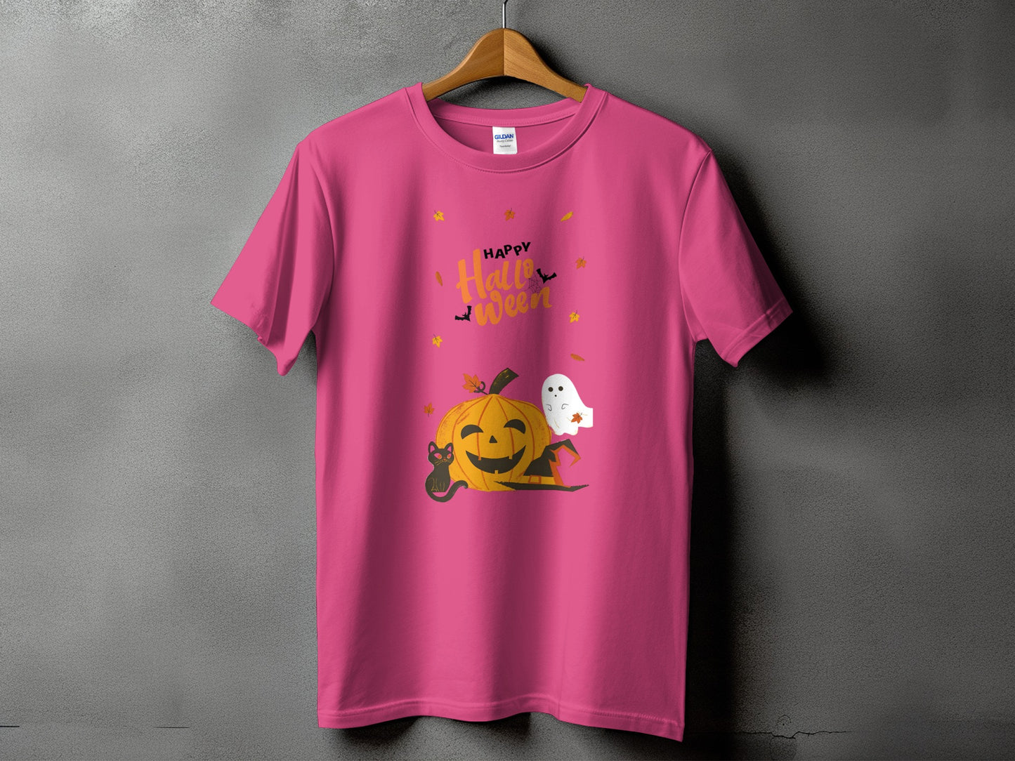 Pink t-shirt with Happy Halloween graphic featuring pumpkin, ghost, and black cat.