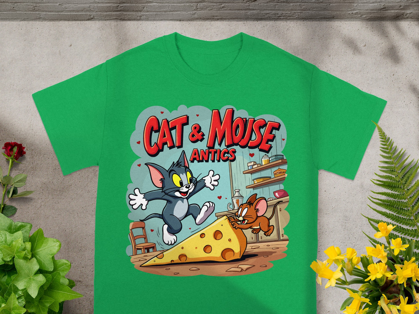 Green t-shirt featuring Tom and Jerry chasing a giant cheese slice.