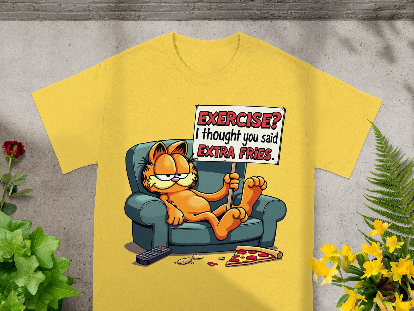 Yellow t-shirt with Garfield on a couch holding a sign saying "EXERCISE? I thought you said EXTRA FRIES."