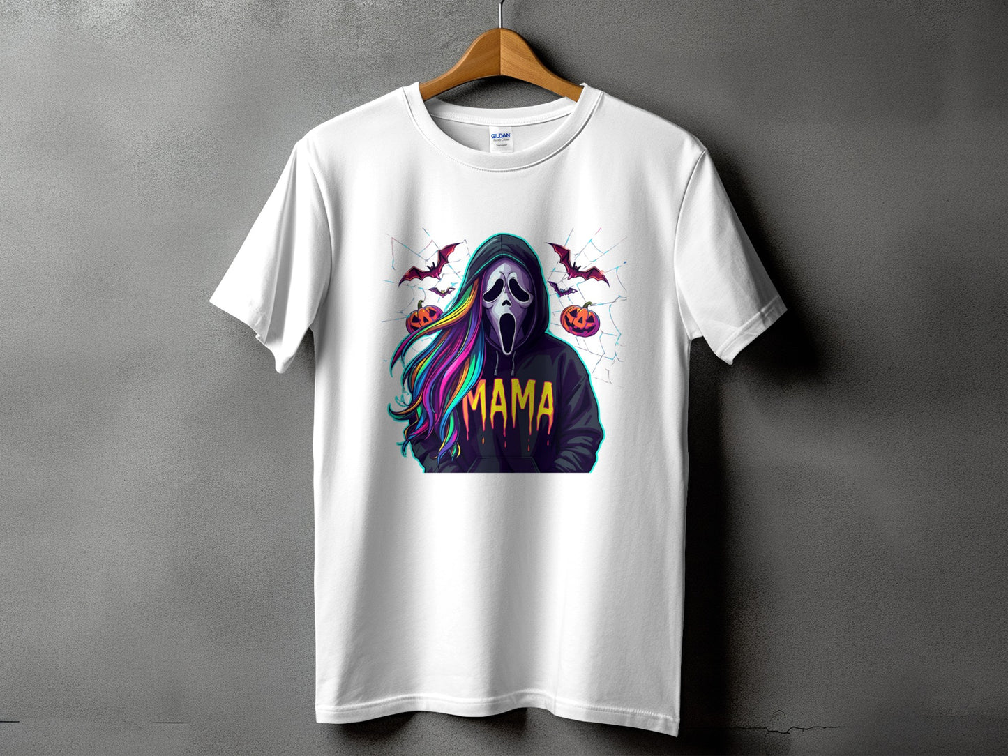 White t-shirt with a Halloween graphic of a ghost, pumpkins, bats, and the word "Mama".