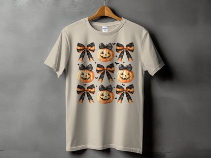 T-shirt with a repeating pattern of jack-o'-lanterns and Halloween bows.