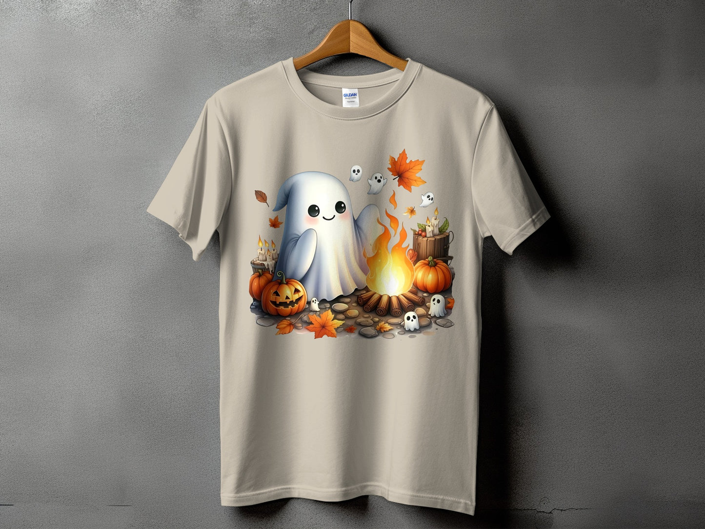 Ghost and pumpkins around campfire on a tan t-shirt.