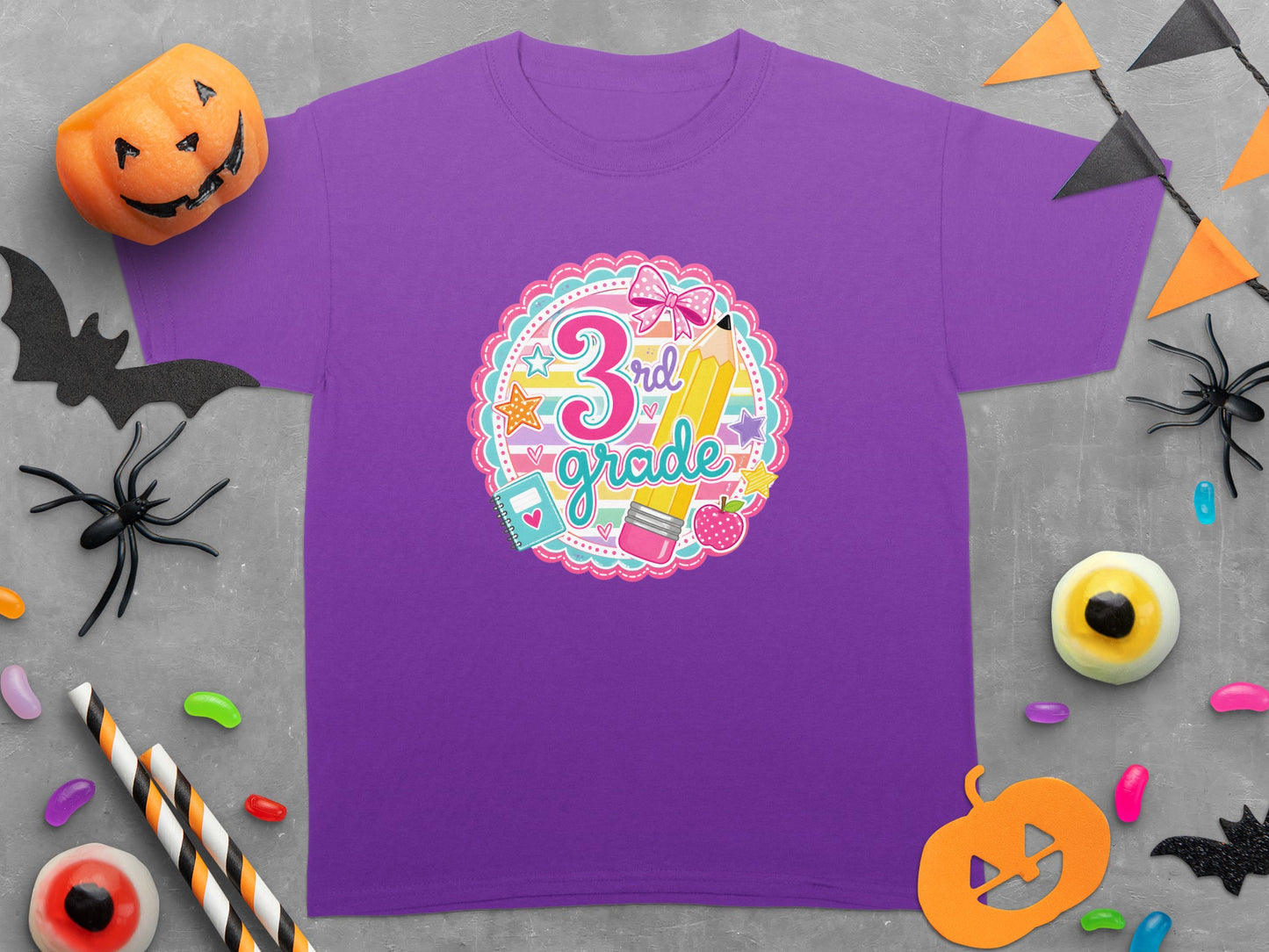 Purple t-shirt with a pink scallop border featuring "3rd grade" and school supplies.
