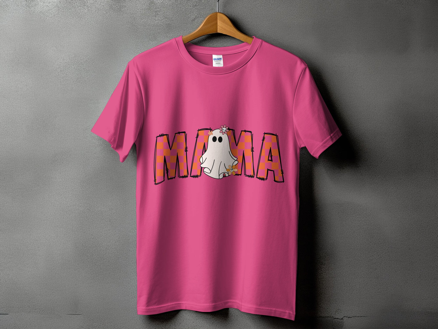 Pink t-shirt with "MAMA" text featuring a ghost and floral accents.