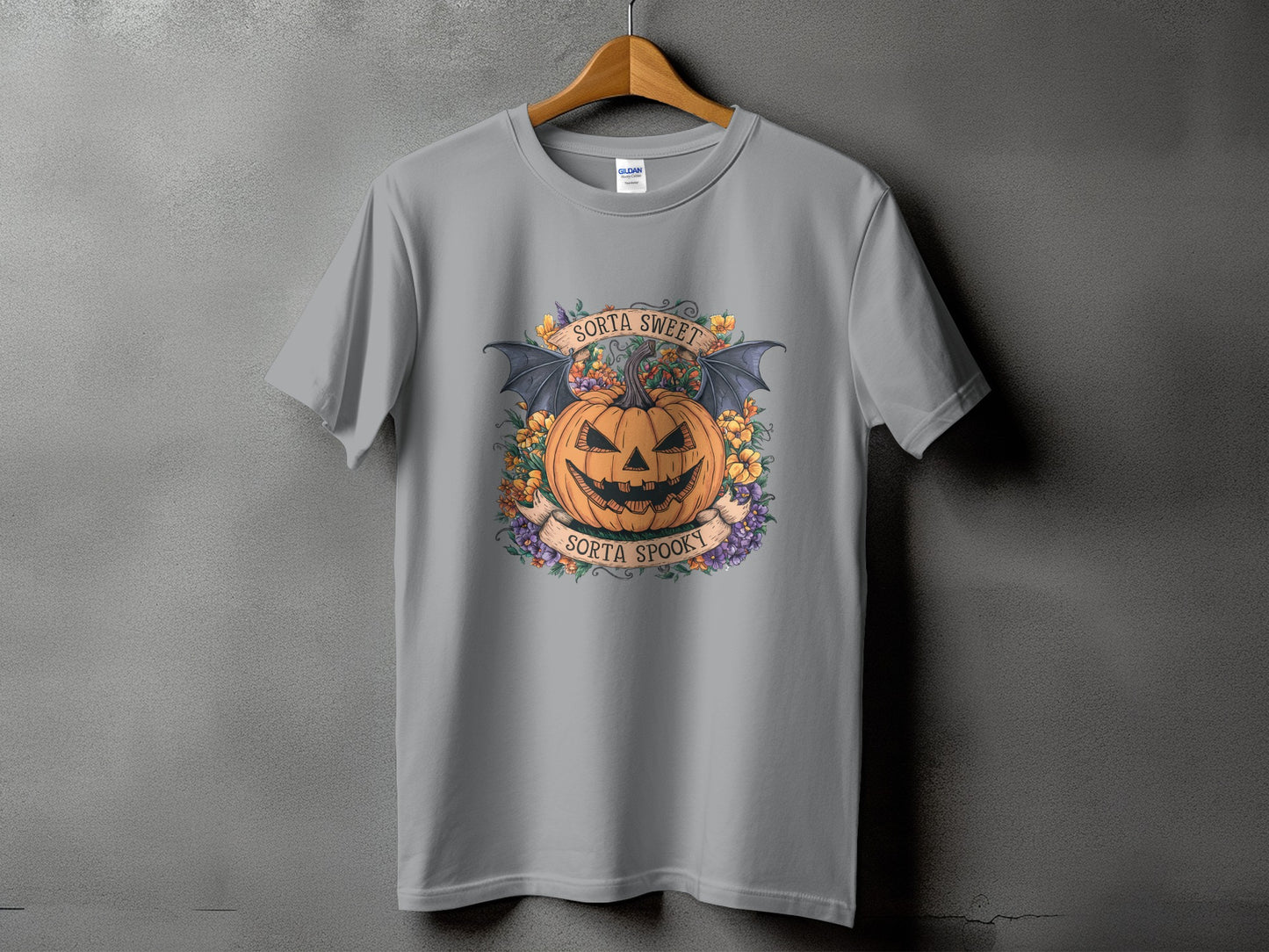 Gray t-shirt with Halloween graphic of a pumpkin, bats, and text "Sorta Sweet Sorta Spooky".
