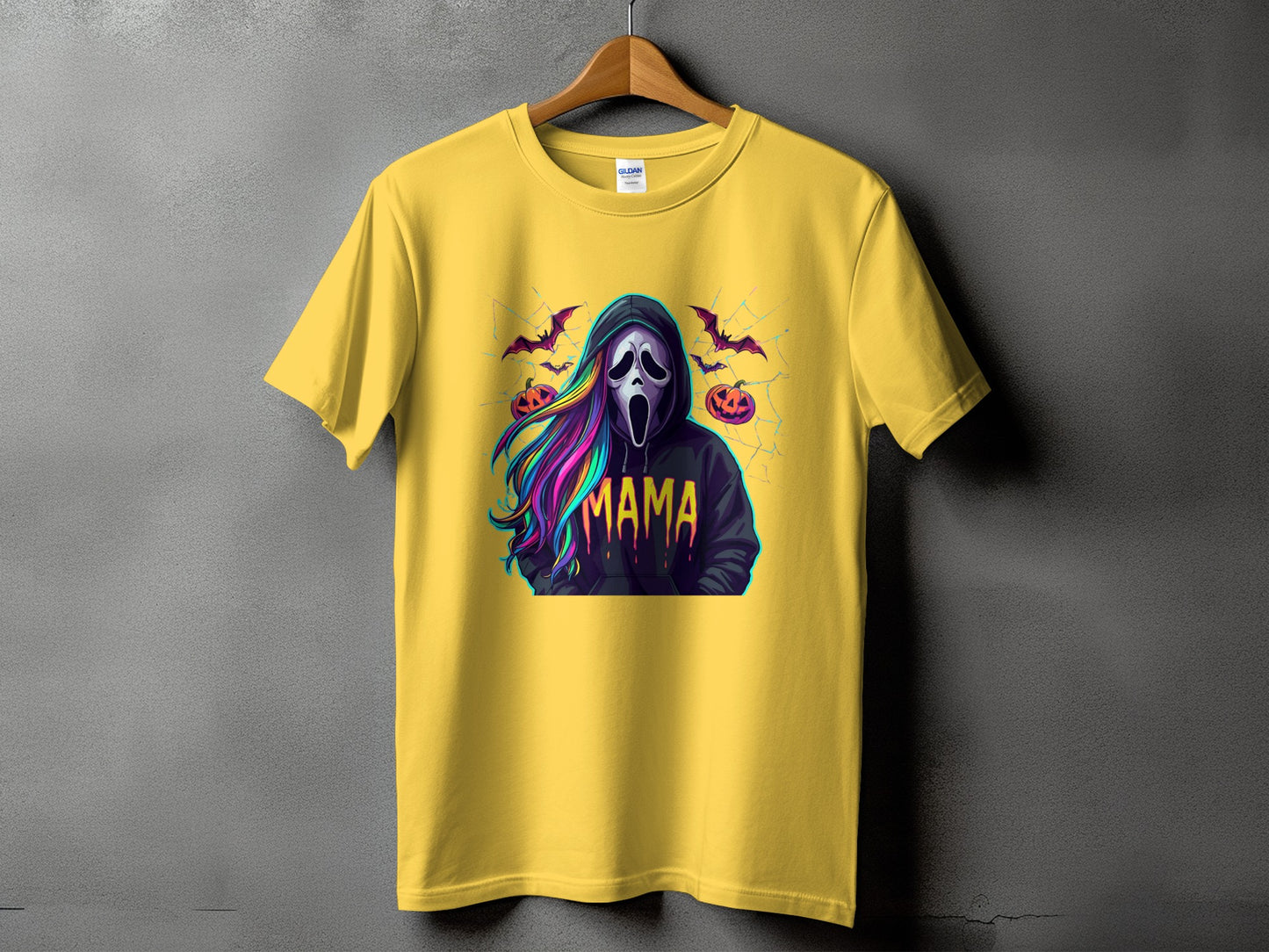 Yellow t-shirt with a Halloween graphic featuring a Scream mask and the word "Mama".