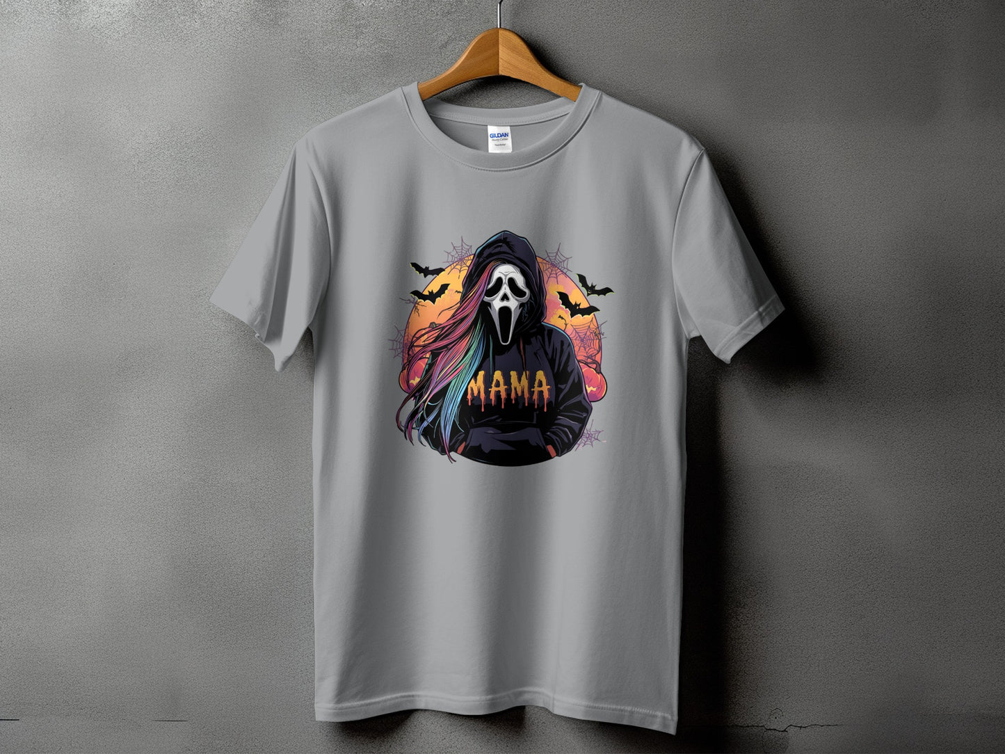 T-shirt with a graphic of a ghost face with rainbow hair and the word "MAMA".