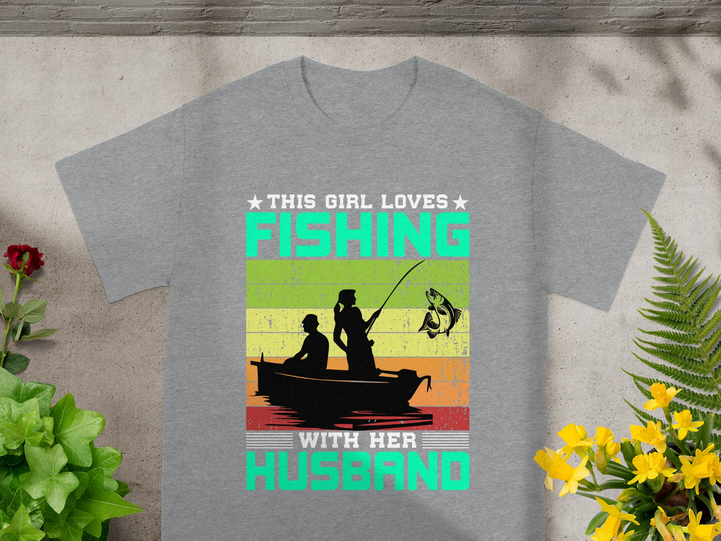 This girl loves fishing with her husband graphic on a gray t-shirt.
