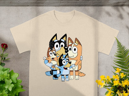 Bluey characters Bingo, Bandit, Chilli, and Bluey in a group hug on a t-shirt.