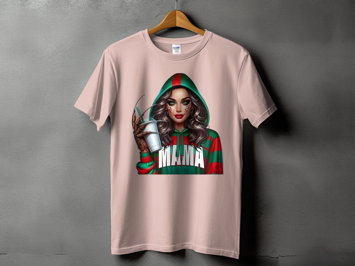 Pink t-shirt featuring a graphic of a woman in a striped green and red hoodie with "Mama" text.