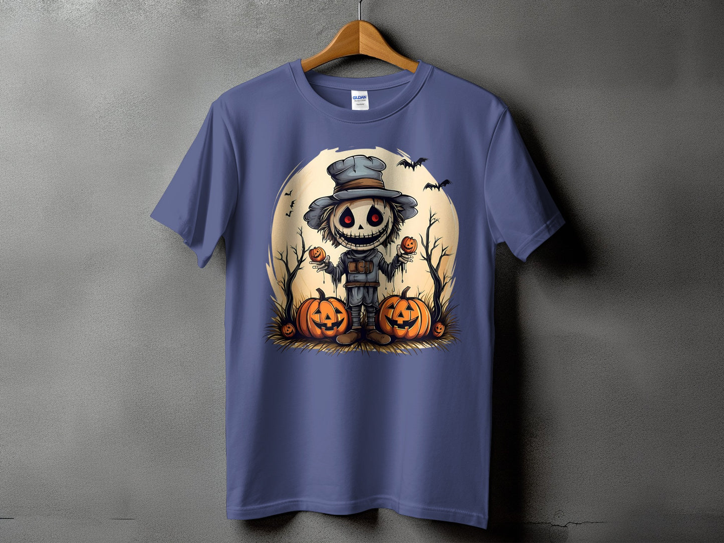 T-shirt with spooky scarecrow and pumpkins design on a large full moon.