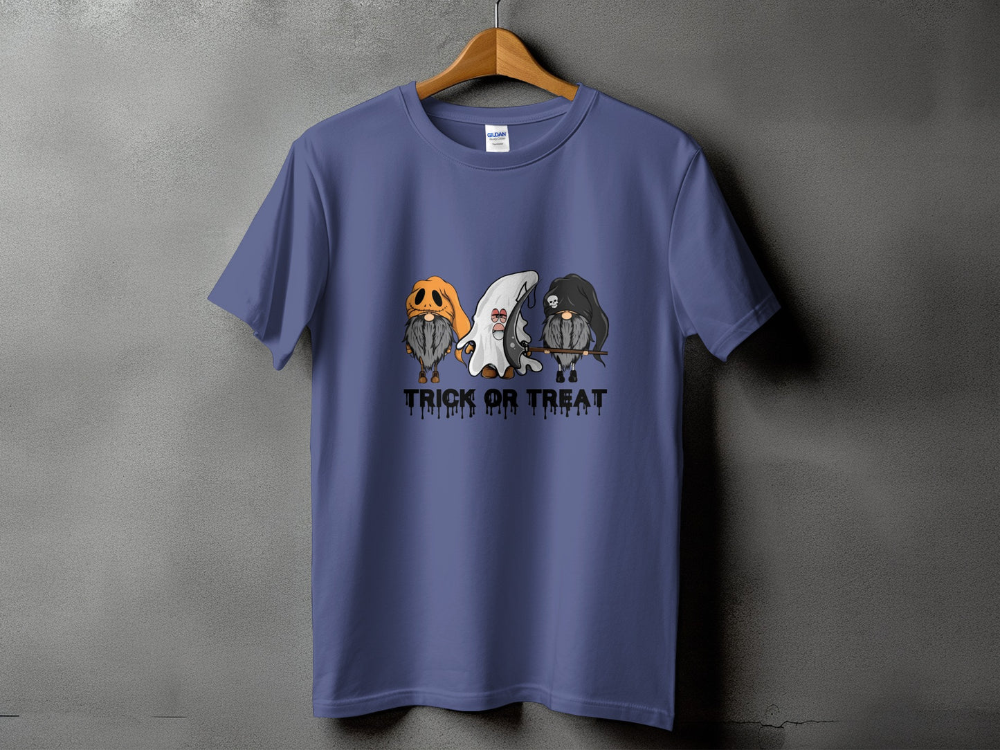 T-shirt with three gnomes in Halloween costumes and "Trick or Treat" text.