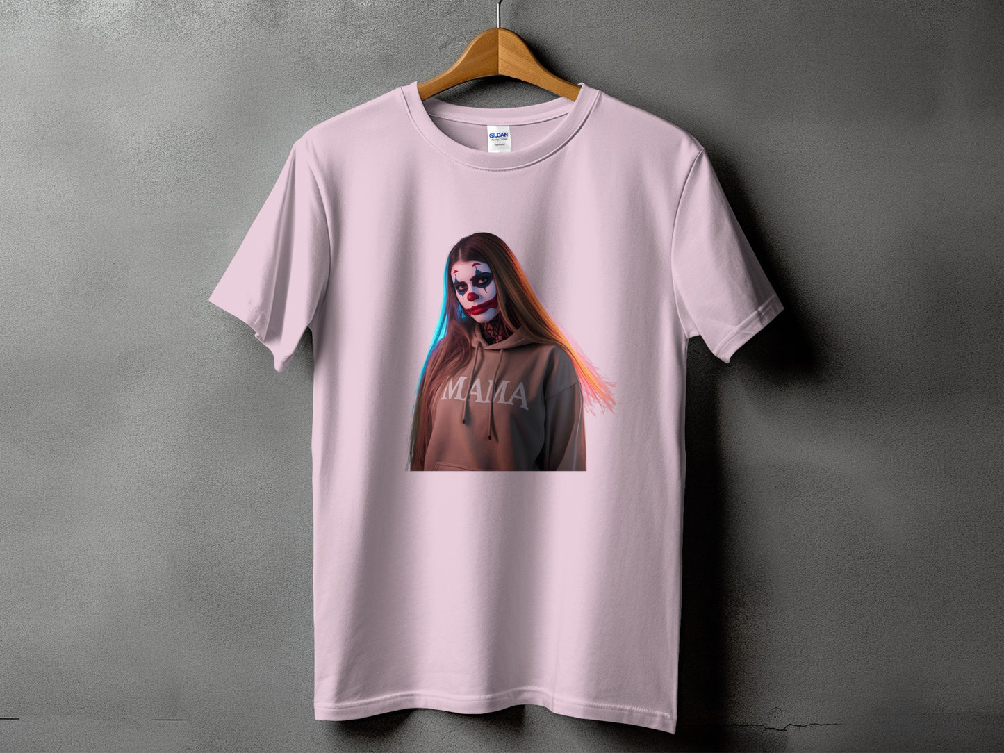 Pink t-shirt with a graphic of a person in clown makeup and the word "Mama".