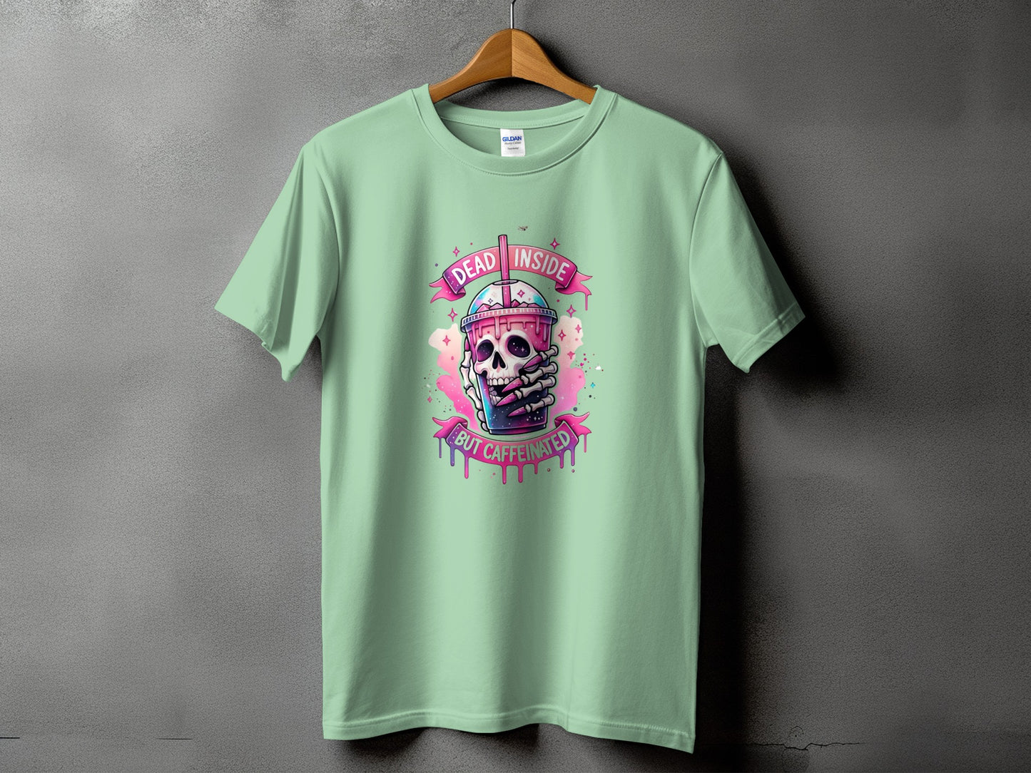 T-shirt with a graphic of a skull holding a coffee cup that says "Dead Inside But Caffeinated".