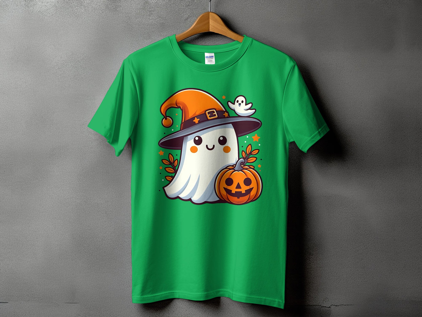 Green t-shirt with cartoon ghost wearing witch hat and holding pumpkin.