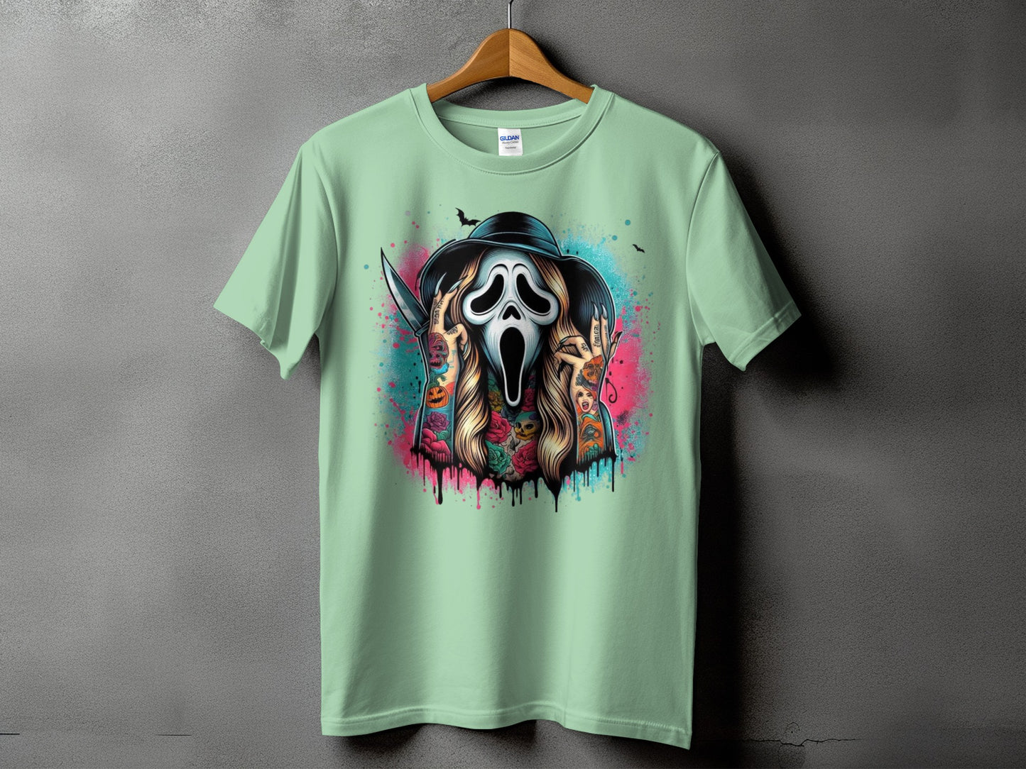 Mint green t-shirt with a Ghostface mask graphic and colorful spray paint drips.
