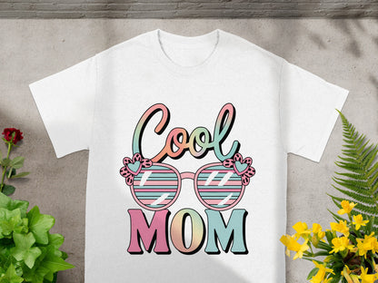White t-shirt with "Cool Mom" text and patterned sunglasses graphic