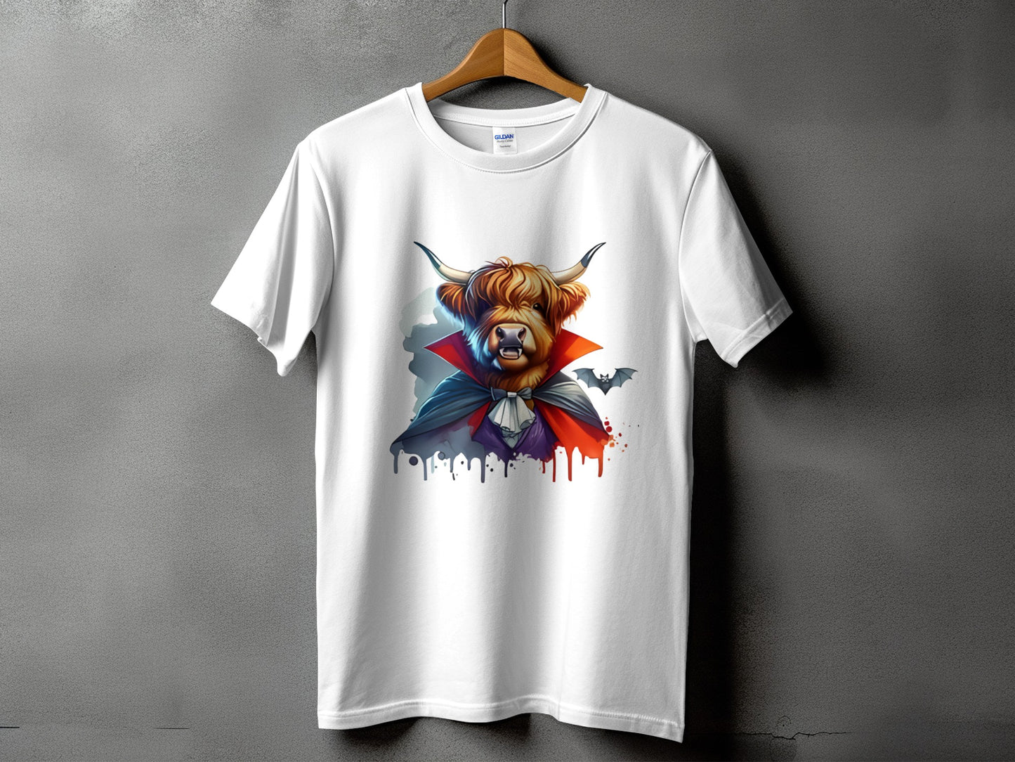 White t-shirt with a Highland cow dressed as a vampire and two bats.