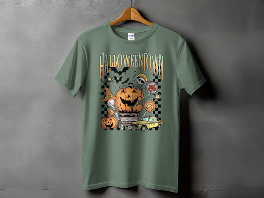 Green t-shirt with Halloweentown graphic featuring pumpkins, bats, and a yellow taxi.