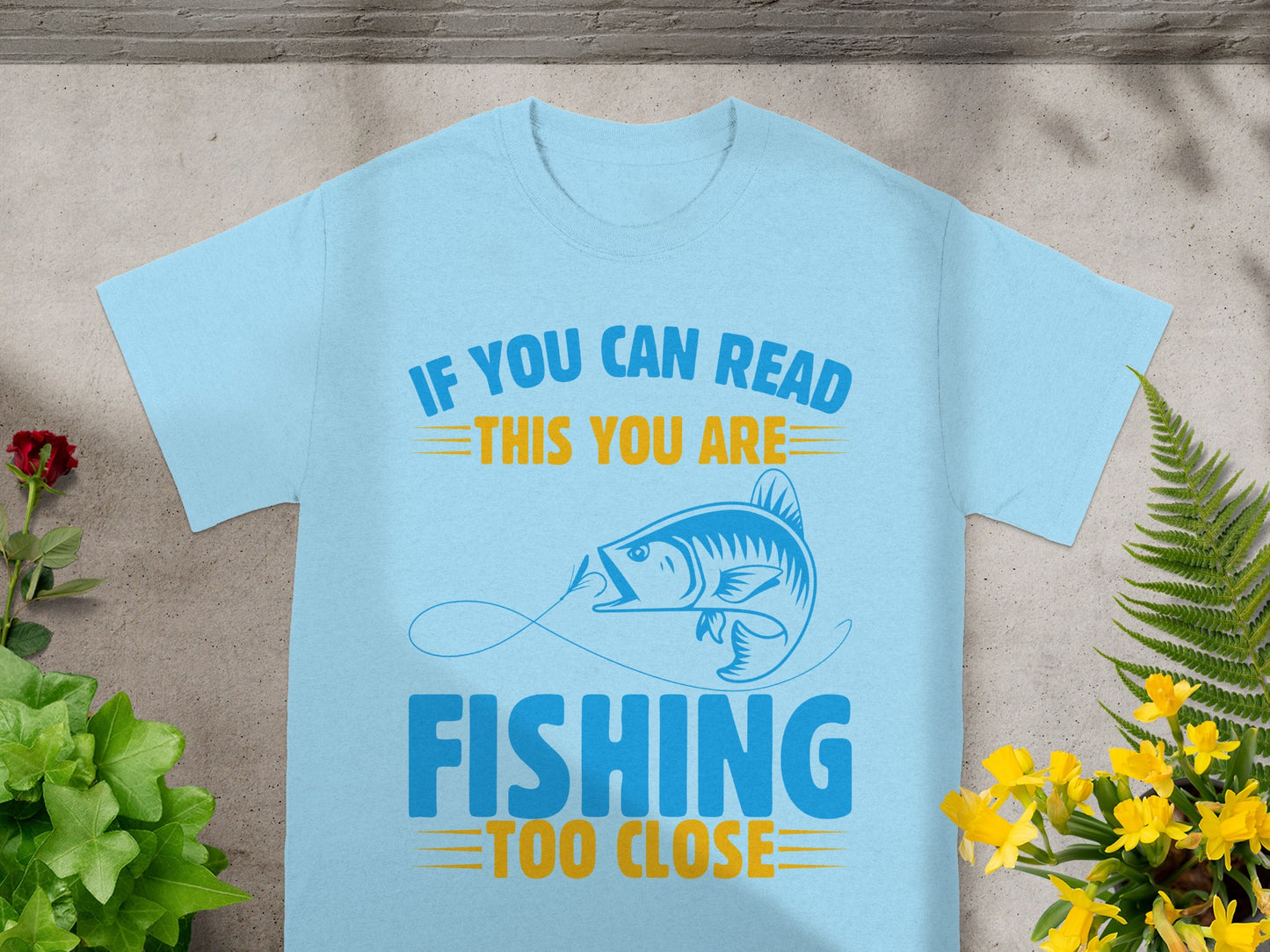 Light blue t-shirt with graphic "IF YOU CAN READ THIS YOU ARE FISHING TOO CLOSE"
