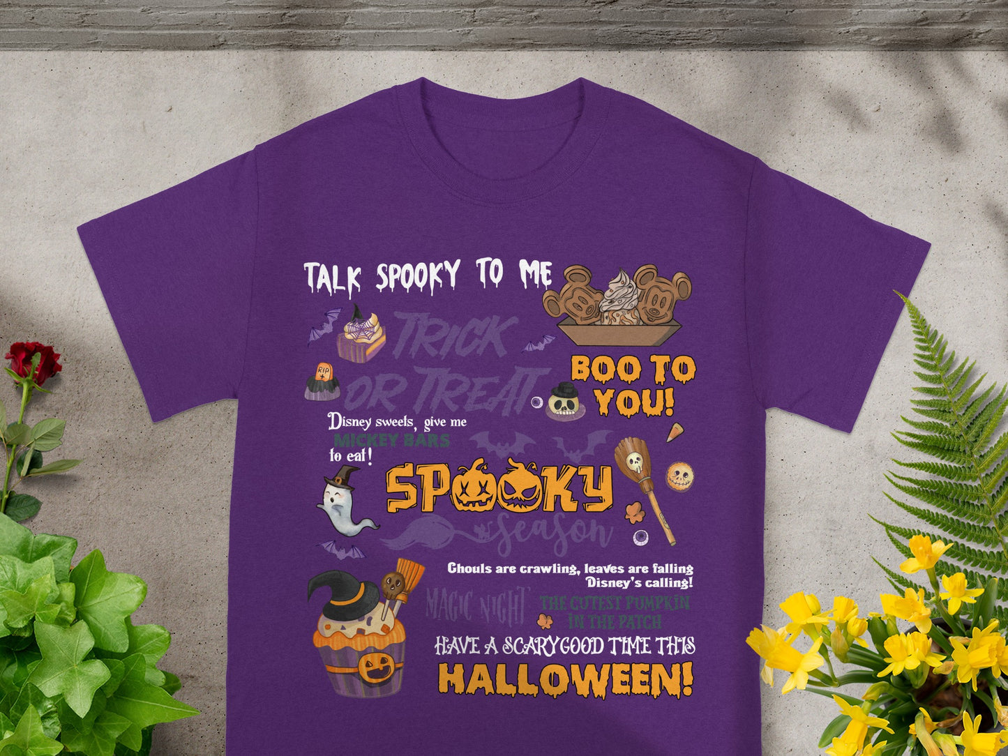 Purple t-shirt with Halloween graphics and text: "Talk Spooky to Me".